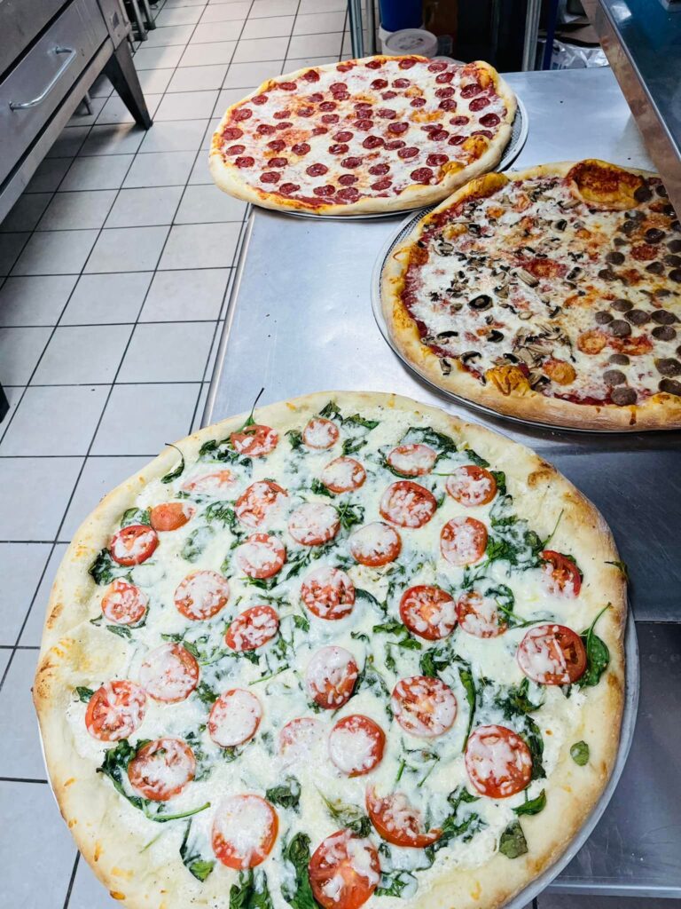 3 pizzas made for an in-store slice special: Fancy White, Meat Lover's, and Pepperoni